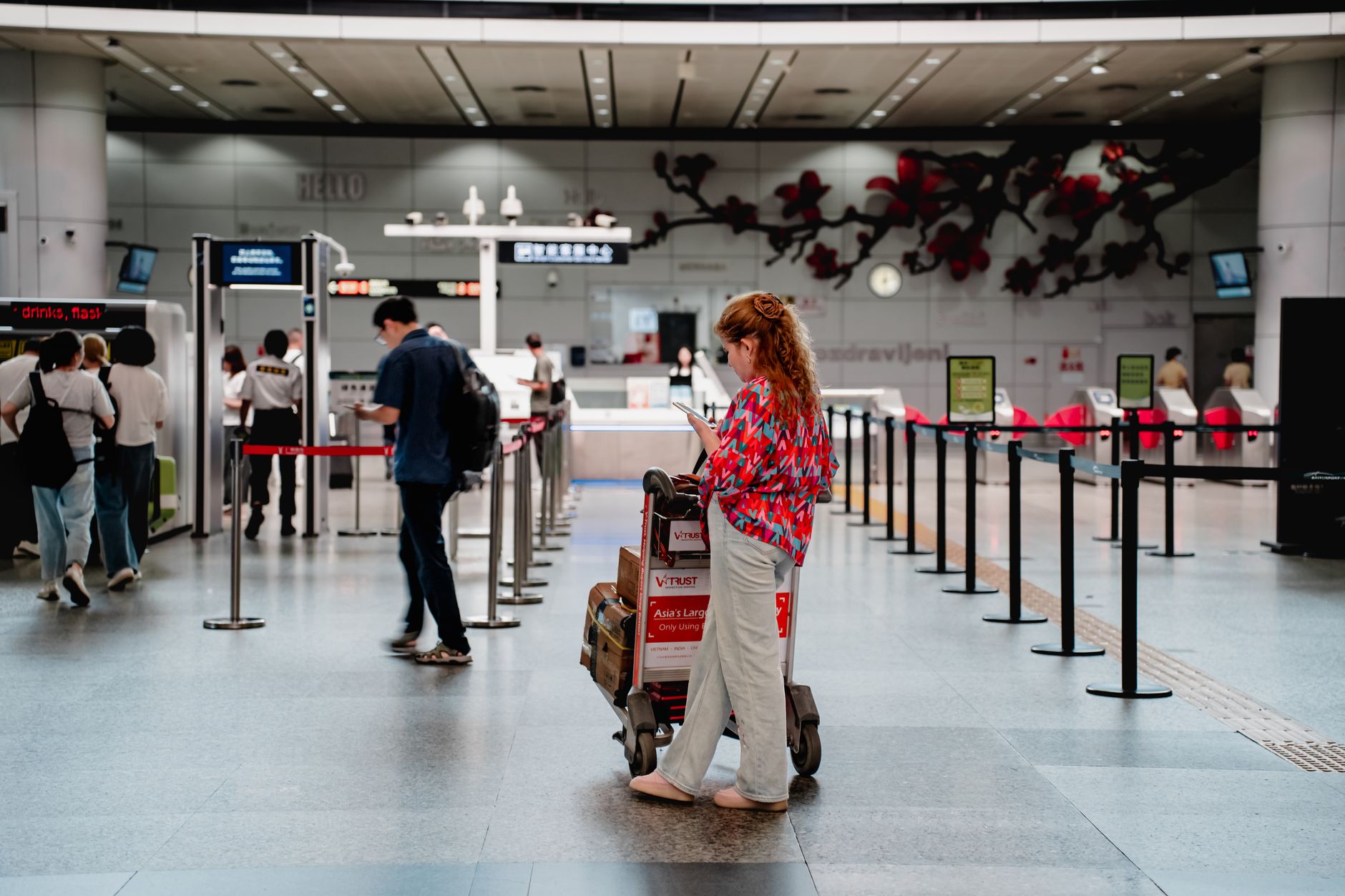 Hunter with rifle case at airport check-in desk preparing to fly to Spain