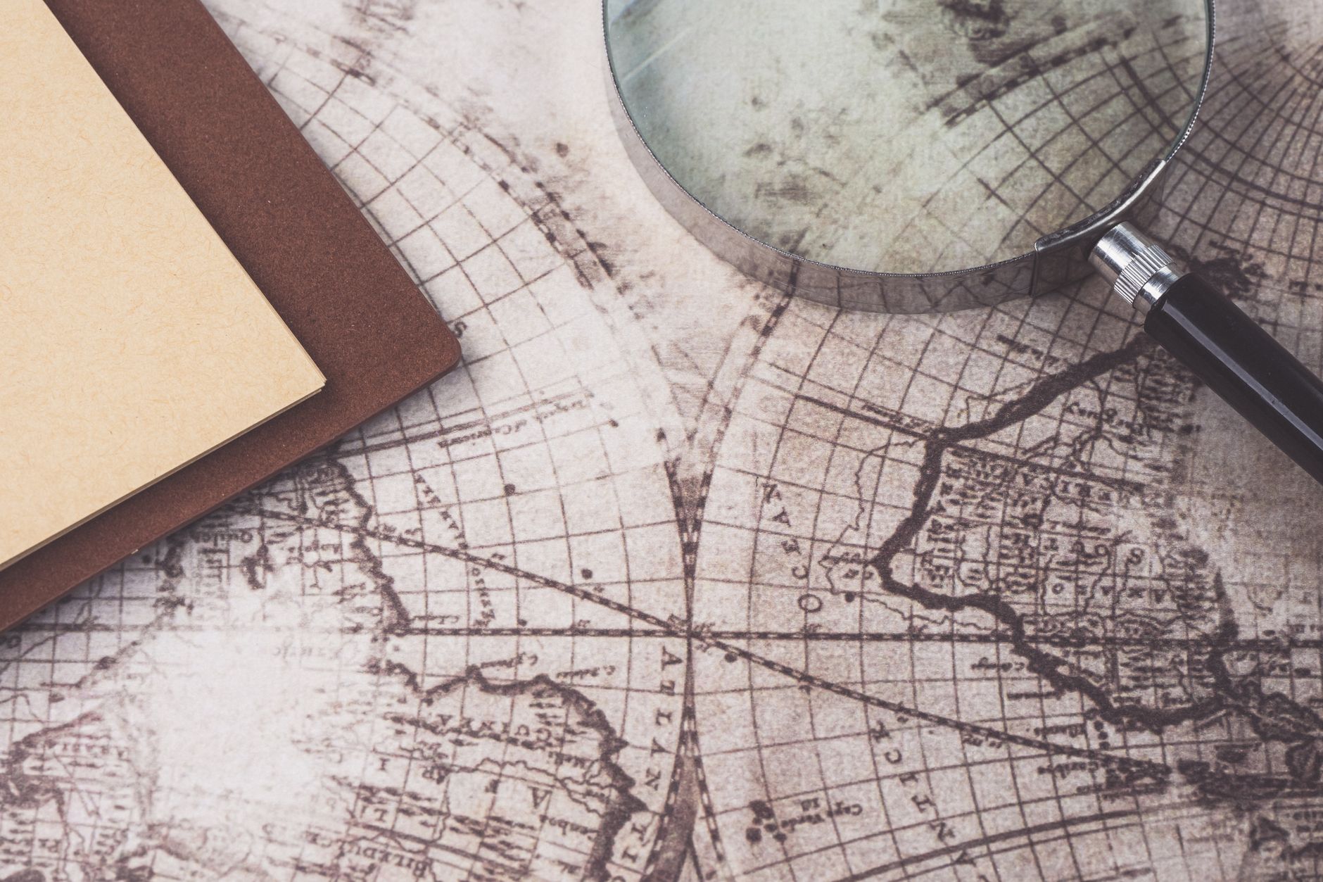 Maps and field documents spread on a table during hunt preparation