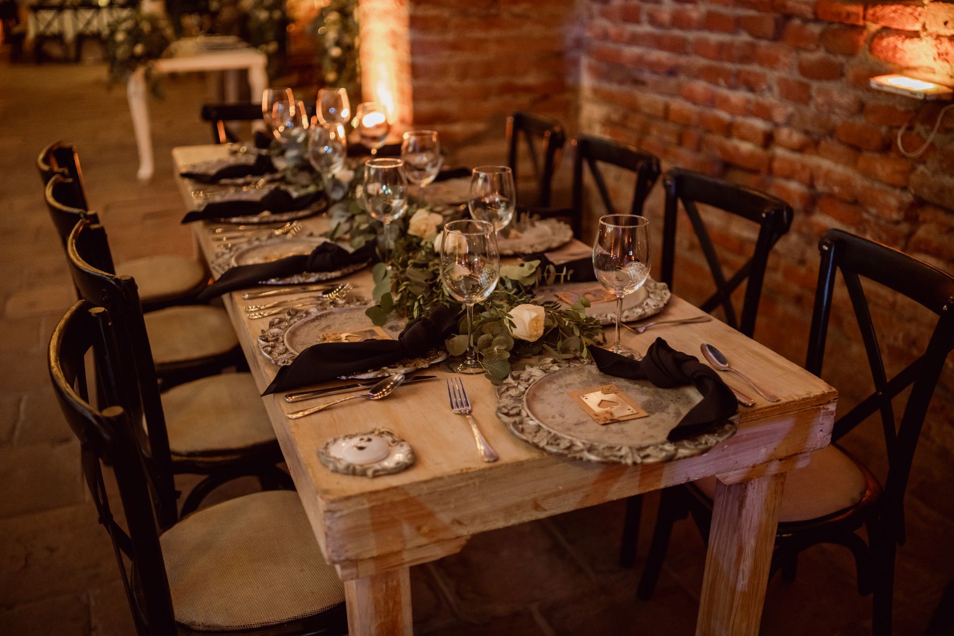 Traditional Spanish hunting lodge dining room set for an evening meal